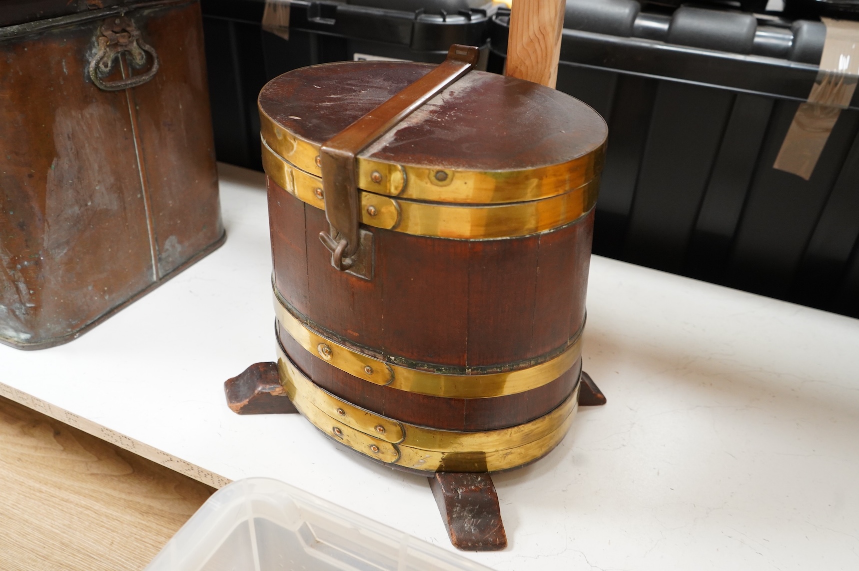 A 19th century teak and brass bound navy rum barrel on stand, 34cm high